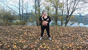 A Stunning Milf With Big Breasts Enjoys Some Public Nudity By The Lake